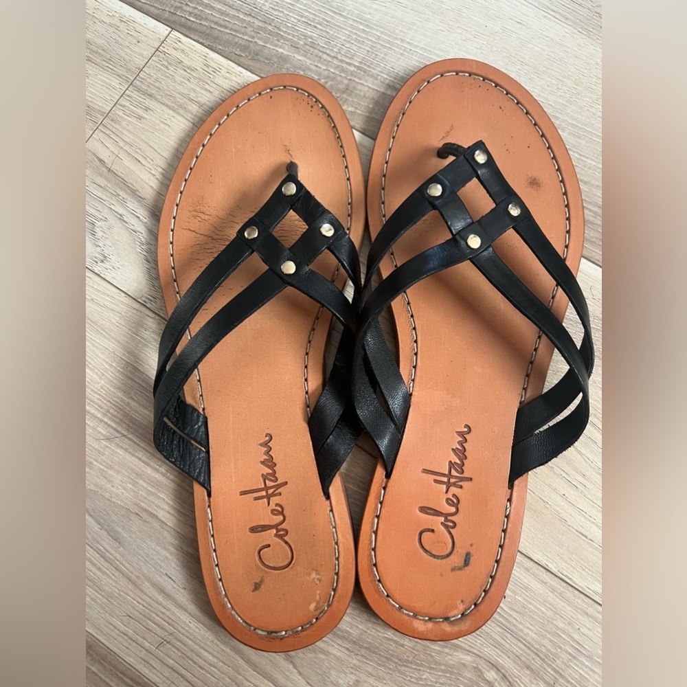 Cole Haan sandals in genuine black leather. Size 7.5. Gold hardware.